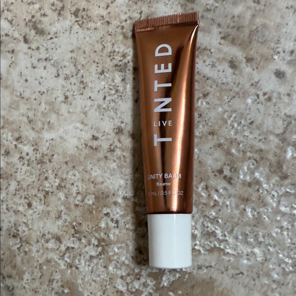 Live Tinted Unity Balm in carnal glaze. New in box